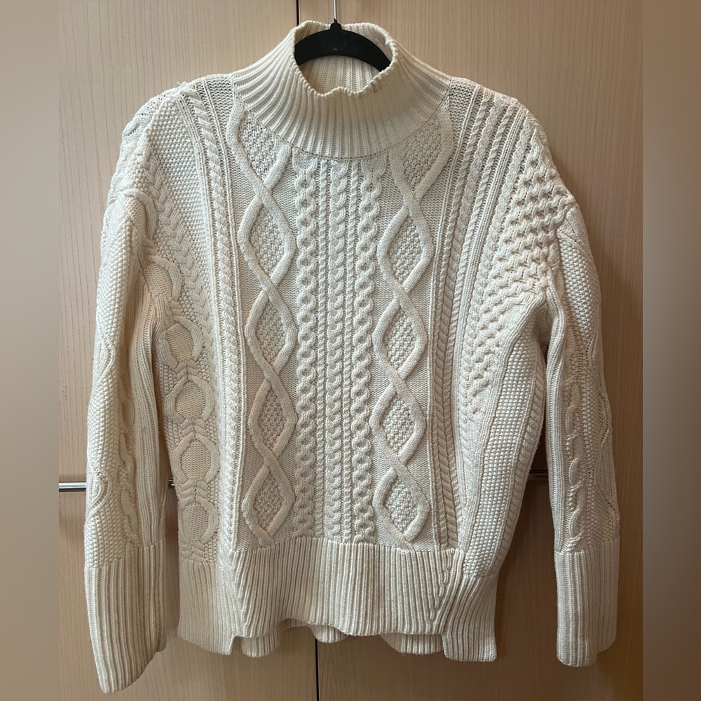 New! Worn once! Beautifully woven cable knit sweater. Perfect condition.
